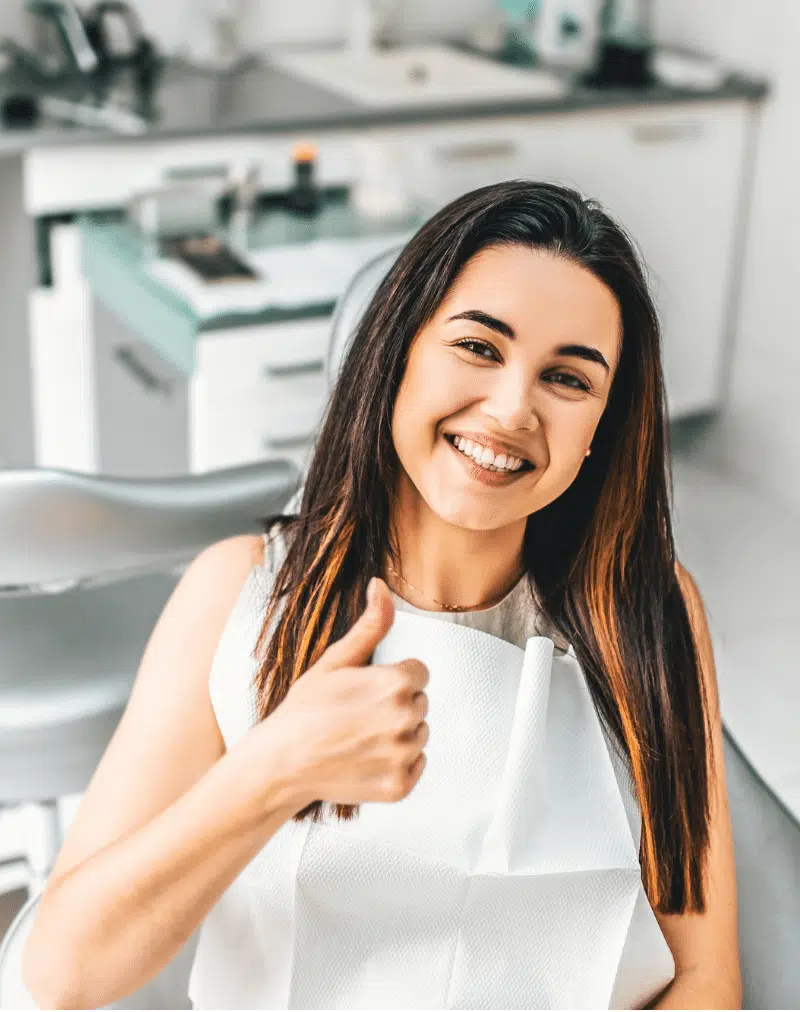 woman smiling at the dentist office