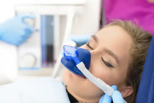 beautiful,getting,woman,inhalation,sedation,at,dental,clinic