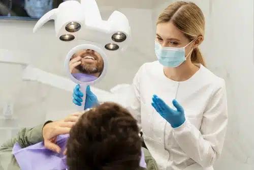 portrait,of,dentist,wearing,protective,mask,,consultation,patient.,male,patient portrait,of,dentist,wearing,protective,mask,,consultation,patient.,male,patient